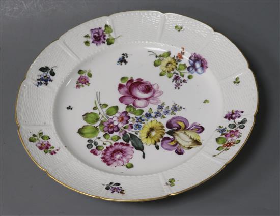 A German Meissen style dish, painted with floral bouquets